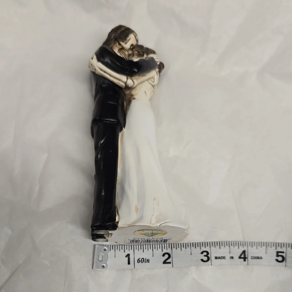 Elegant Black and White Embracing Couple Figurine